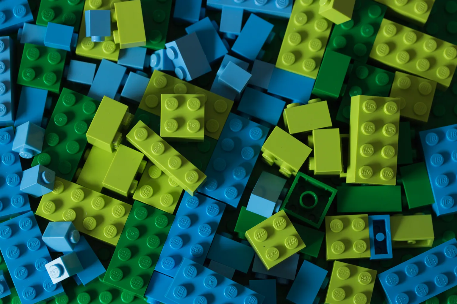 A jumbled pile of blue and green LEGO bricks — the studio's fixed set of pieces, sorted and re-sorted by colour for every frame of the animation